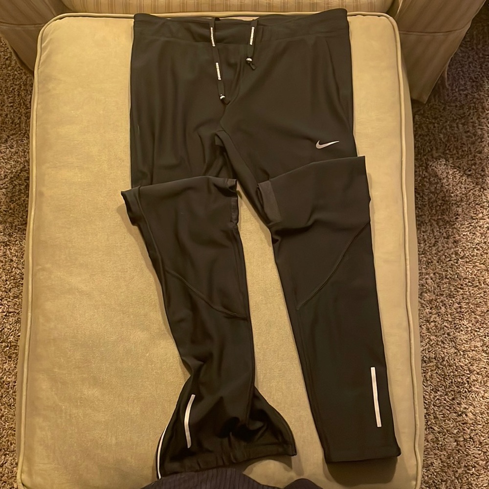 Nike Running Dri-fit Pants with Waistband Pocket and zipper ankle cuffs.